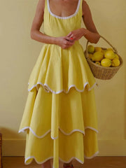 Yellow ruffled hem maxi dress with white trim