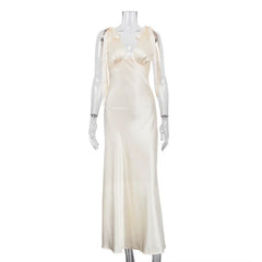 White evening gown on a mannequin against a white background