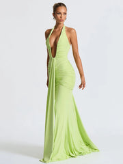 Woman wearing a bright green evening gown on a white background