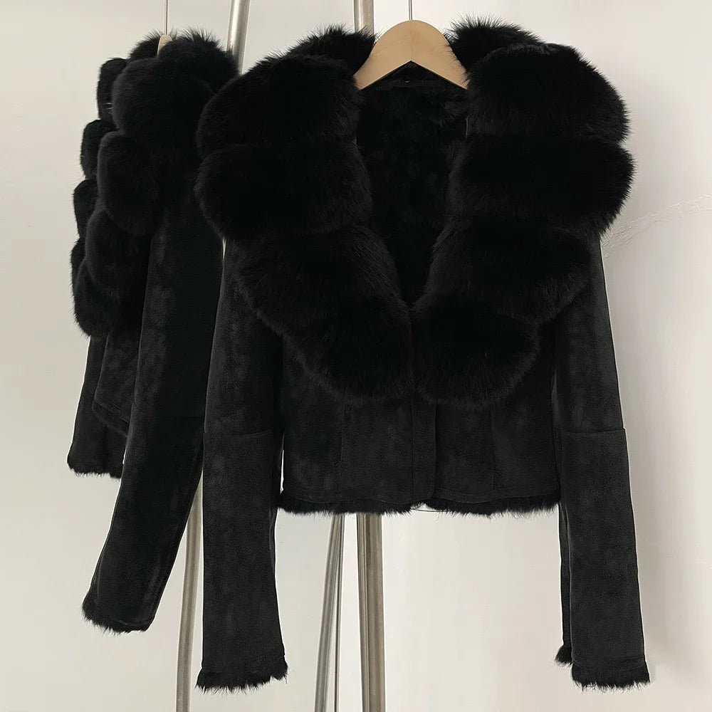 Black faux fur jacket on a hanger against a white background