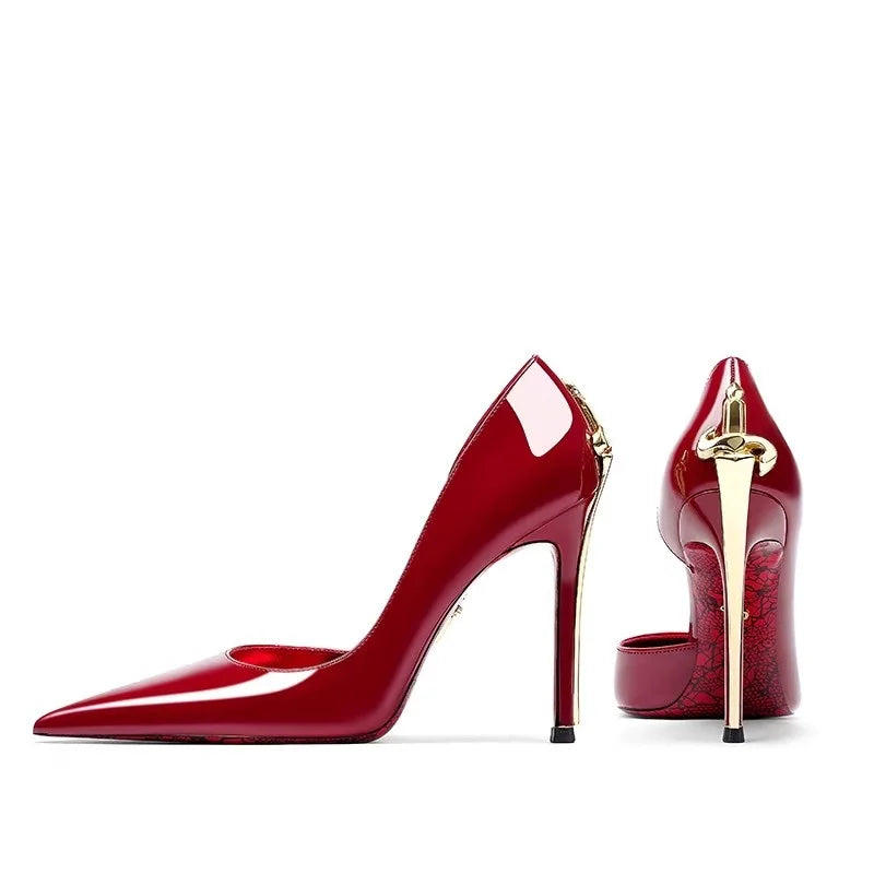 Red high-heeled shoes with gold accents on a white background