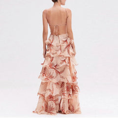 Woman wearing a floral tiered dress on a white background