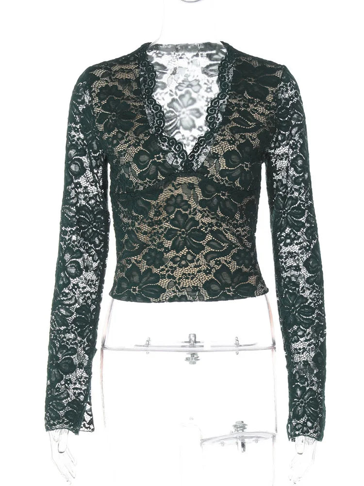 Black lace long-sleeve top on a mannequin against a white background