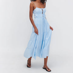 Woman wearing a light blue dress on a white background