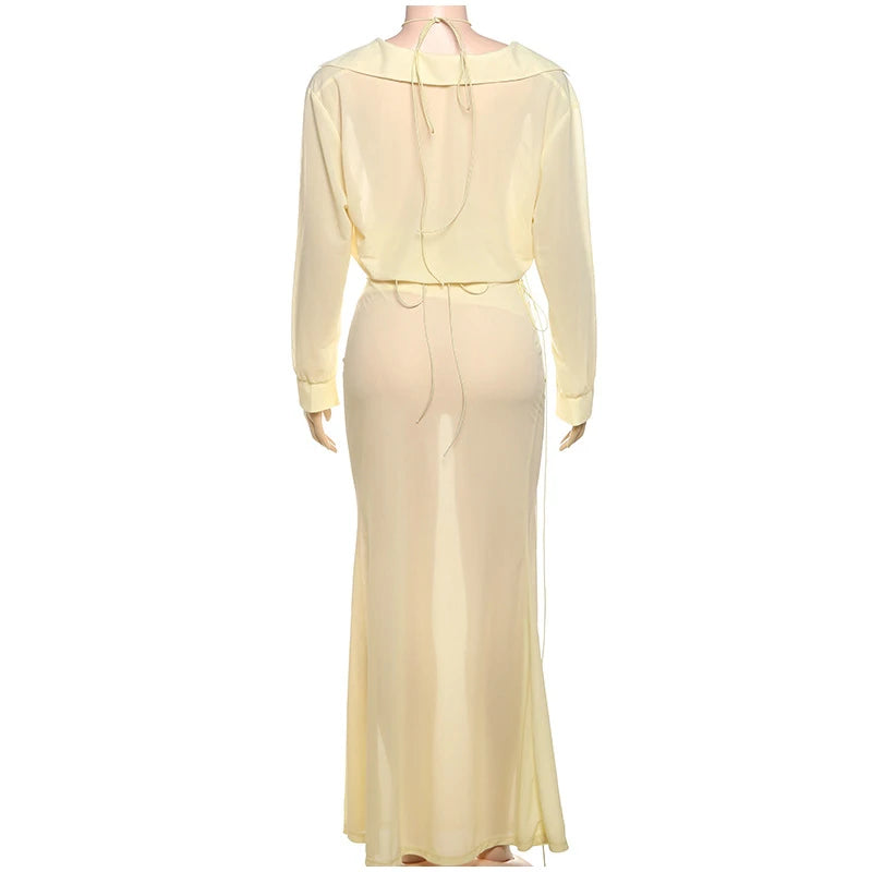 Light yellow dress on a mannequin against a white background