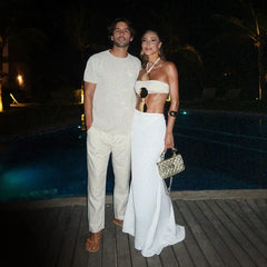 Couple posing by pool in white swimwear