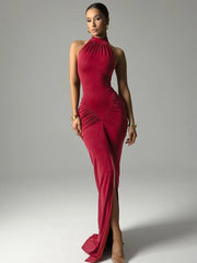 Woman wearing a red evening gown on a gray background