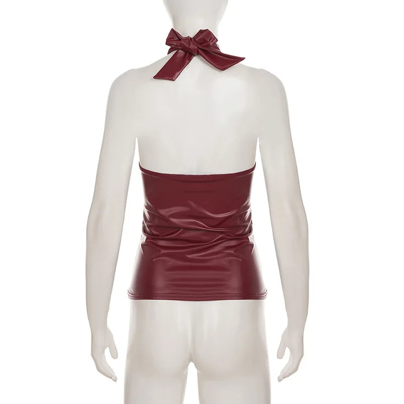 Mannequin wearing a burgundy halter top with a bow tie on a white background
