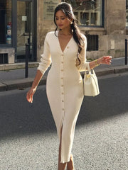 Woman in a white dress walking on a street