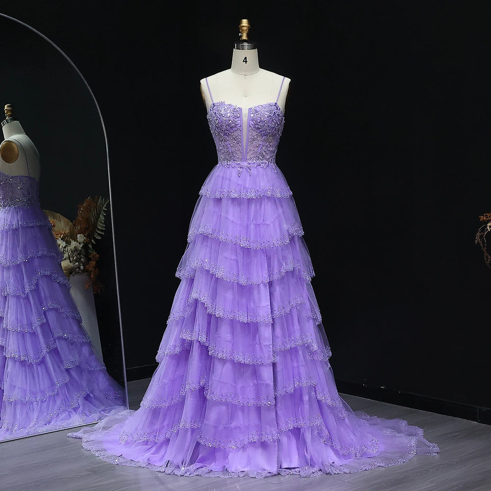 Purple evening gown on a mannequin against a black background