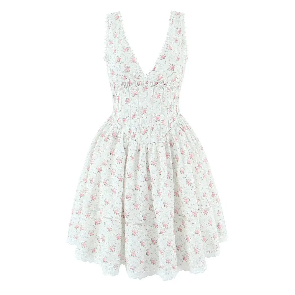 White dress with pink floral pattern on a white background