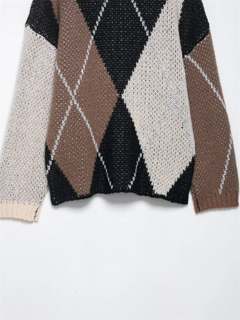 Close-up of a knitted sweater with argyle pattern on a white background