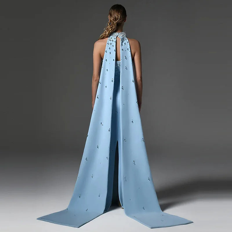 Strapless long gown with diamond embellishments and detachable cape back view.