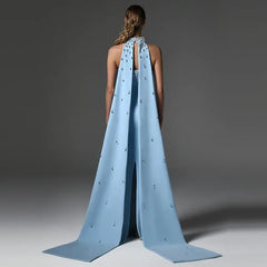 Strapless long gown with diamond embellishments and detachable cape back view.