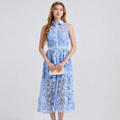 Woman wearing a light blue lace dress on a white background