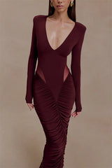 Maroon evening gown with cut-out design on a beige background