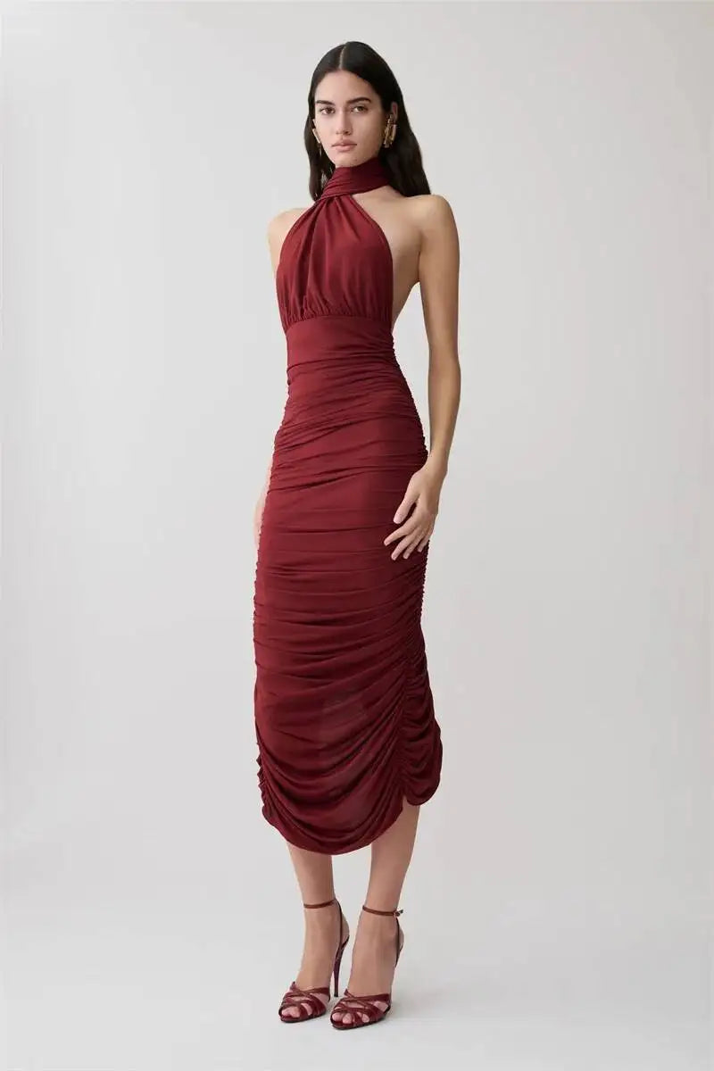 Back view of burgundy halter neck ruched midi dress