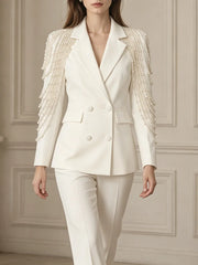 White double-breasted blazer with pearl tassel detailing on the shoulders
