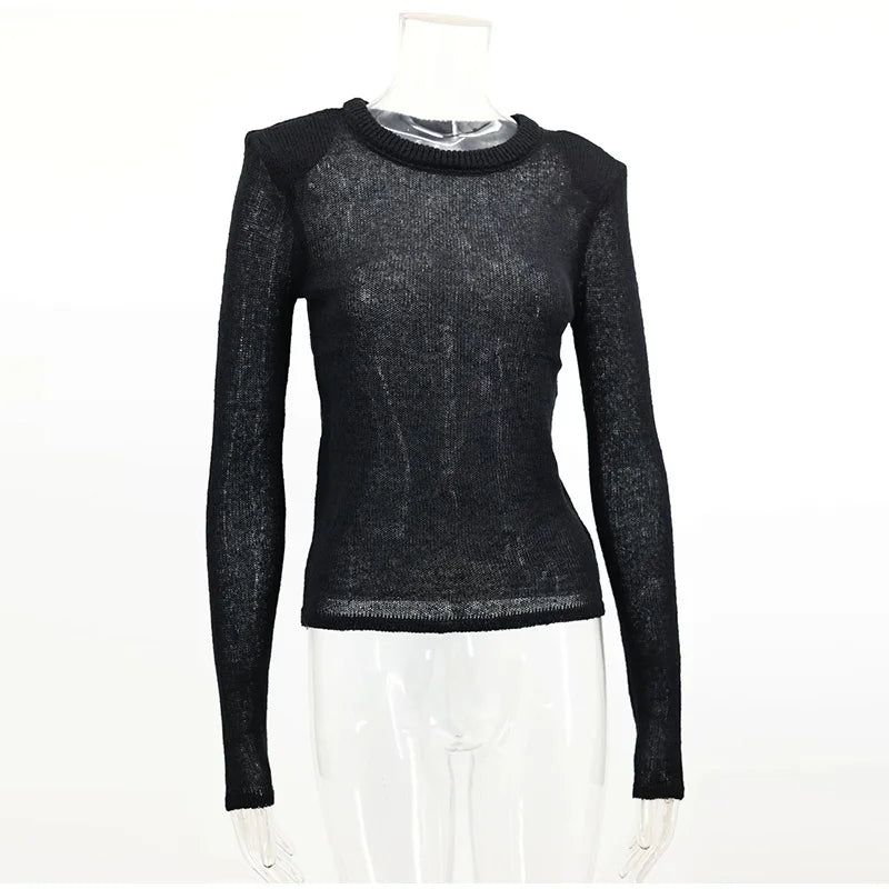 Black long-sleeve top on a mannequin against a white background