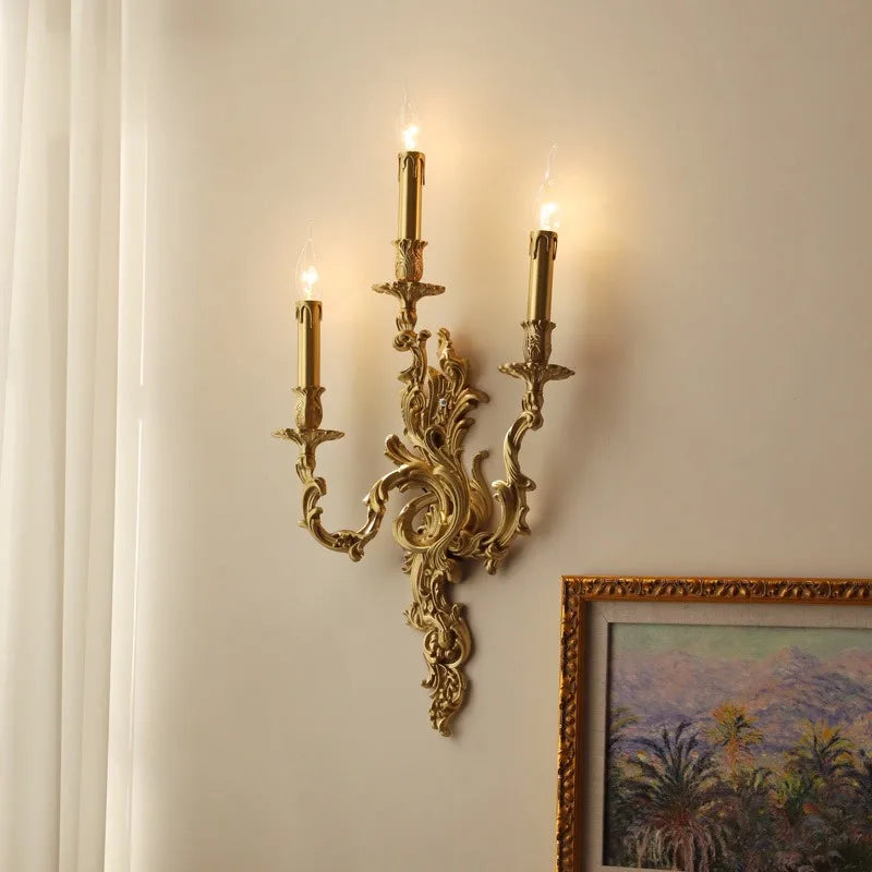 An elegant copper wall lamp with a vintage-inspired design, illuminating a hallway with a warm glow.