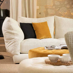 Designer white modular sofa with arc configuration and artistic details

