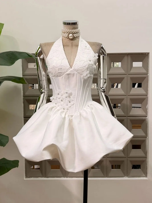 White appliqued floral halter mini dress with corseted bodice and bubble hem