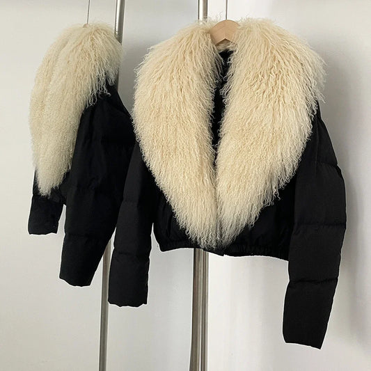 Black cropped puffer jacket with a large cream-colored fur collar.