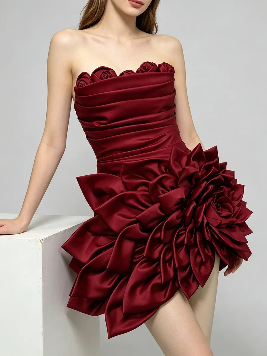 Strapless ruffled flower mini dress leaning on cube