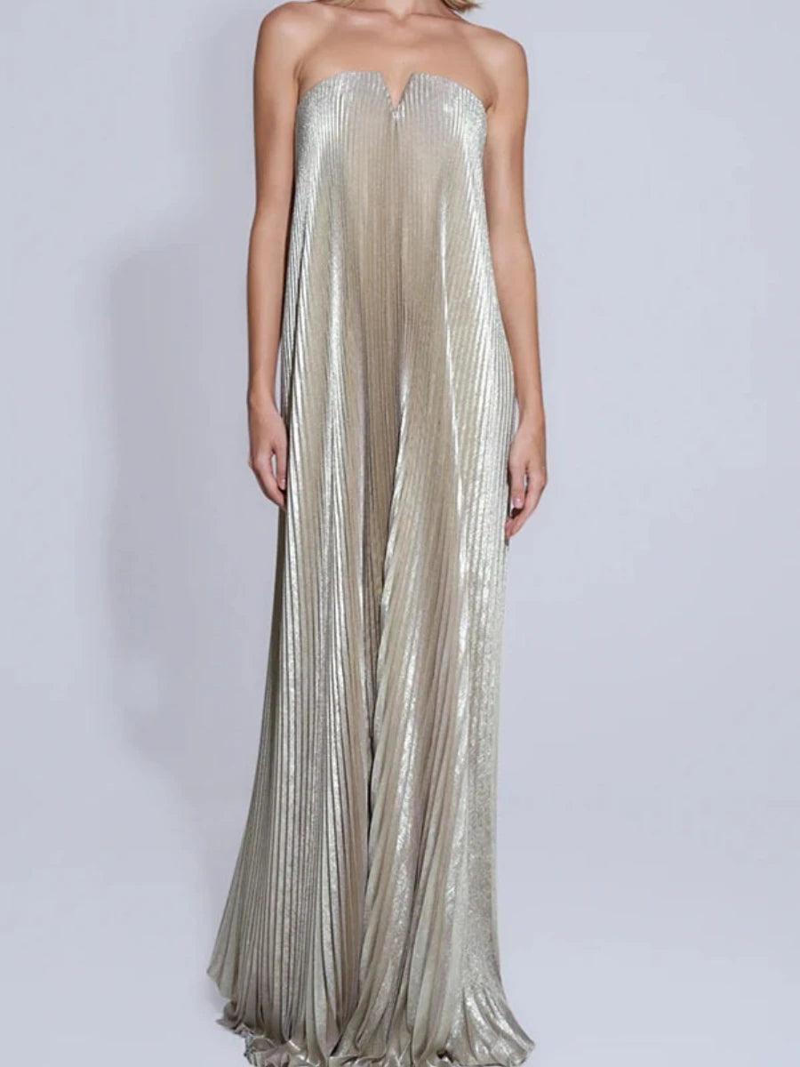 Silver strapless gown on a plain background