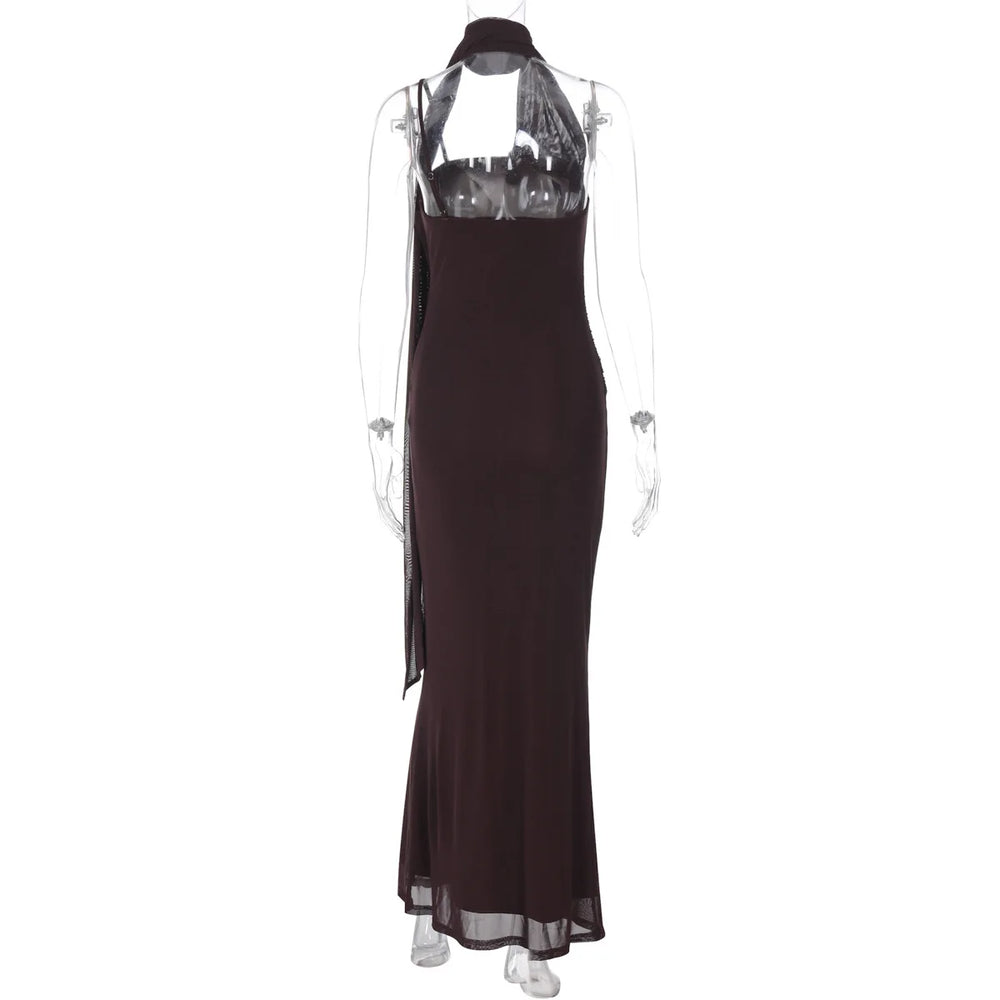 Black evening gown on a mannequin with a white background