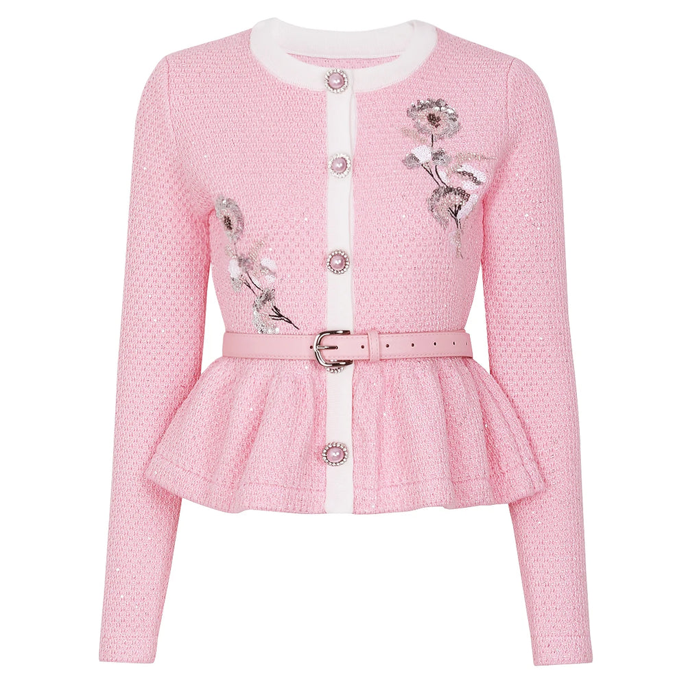 Pink embroidered peplum knit cardigan with a white trim and belt.