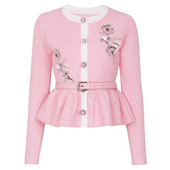 Pink embroidered peplum knit cardigan with a white trim and belt.