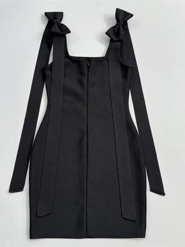 Black dress with bow straps on a white background