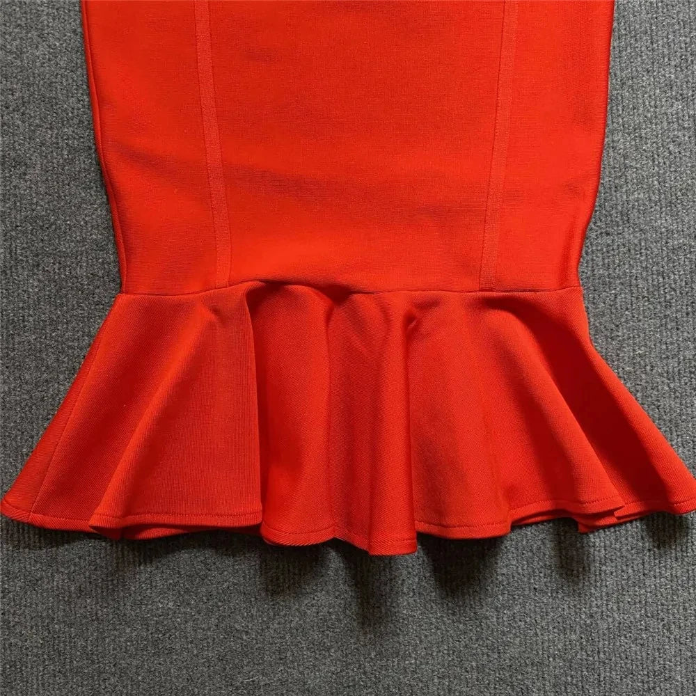 Red dress with a ruffled skirt on a gray background