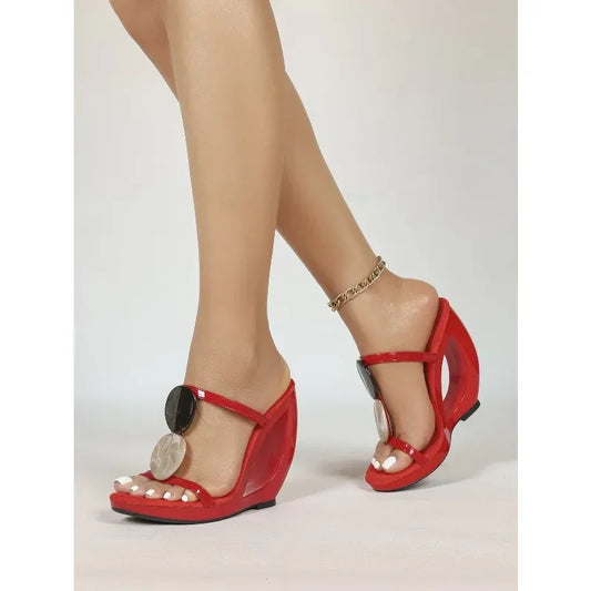 Red patent leather wedge sandals with hollow-out heel and shell detail