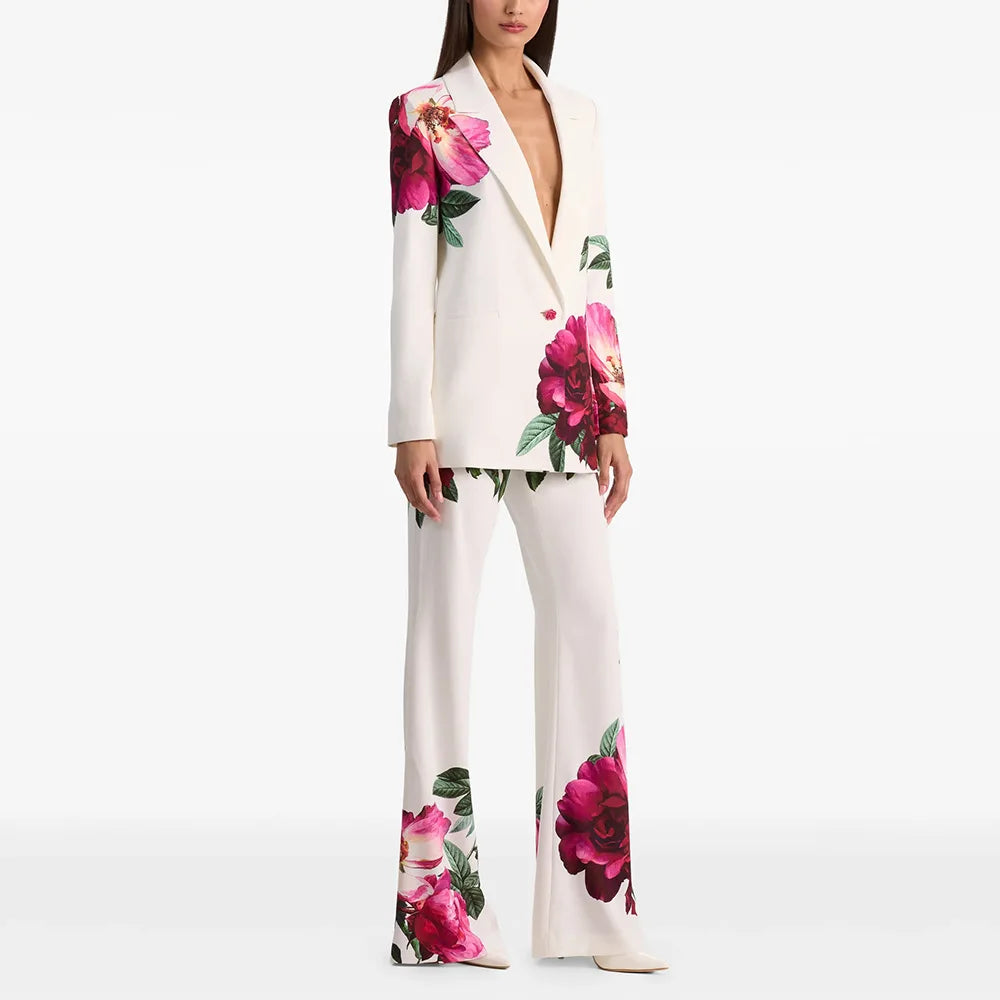 Floral print blazer and flare pants suit on a model.