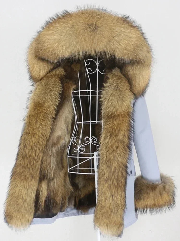 Fur coat with a large hood on a mannequin against a white background