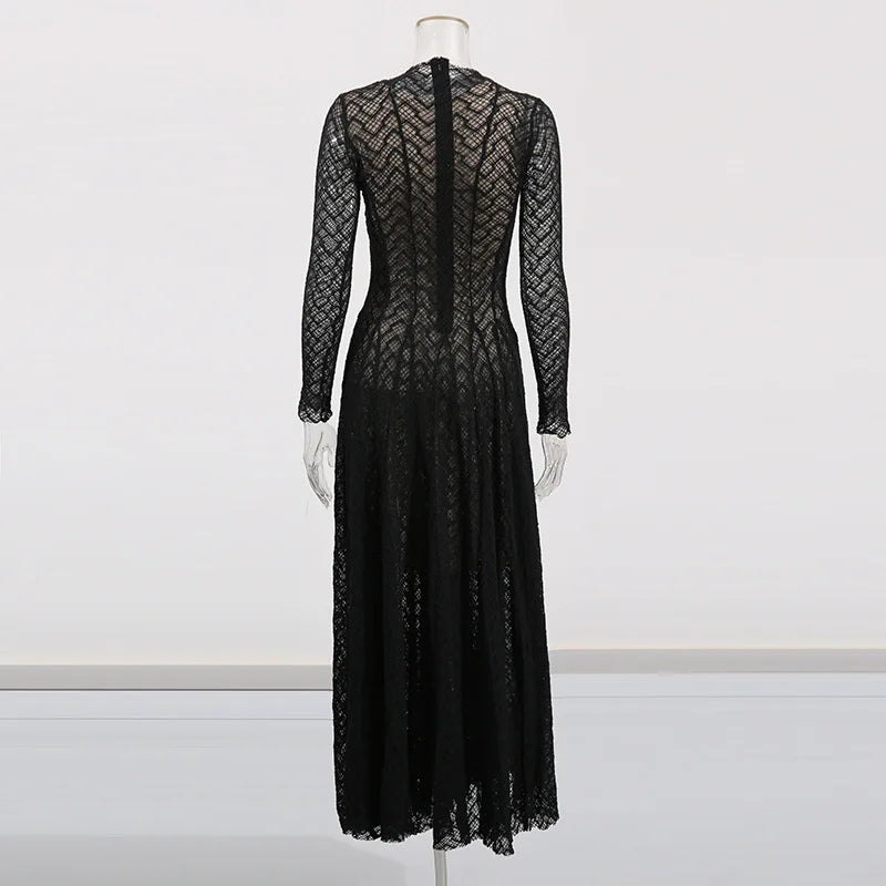 Black lace dress on a mannequin against a white background