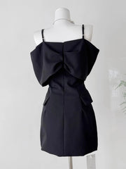 Black dress on a mannequin against a white background