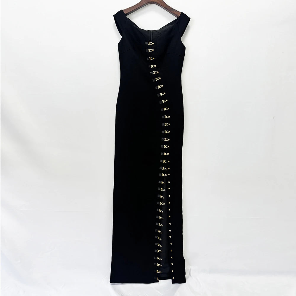 Black off shoulder maxi dress with metal buckle detailing displayed on a hanger.