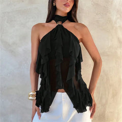 Woman wearing a black one-shoulder ruffled top against a neutral background