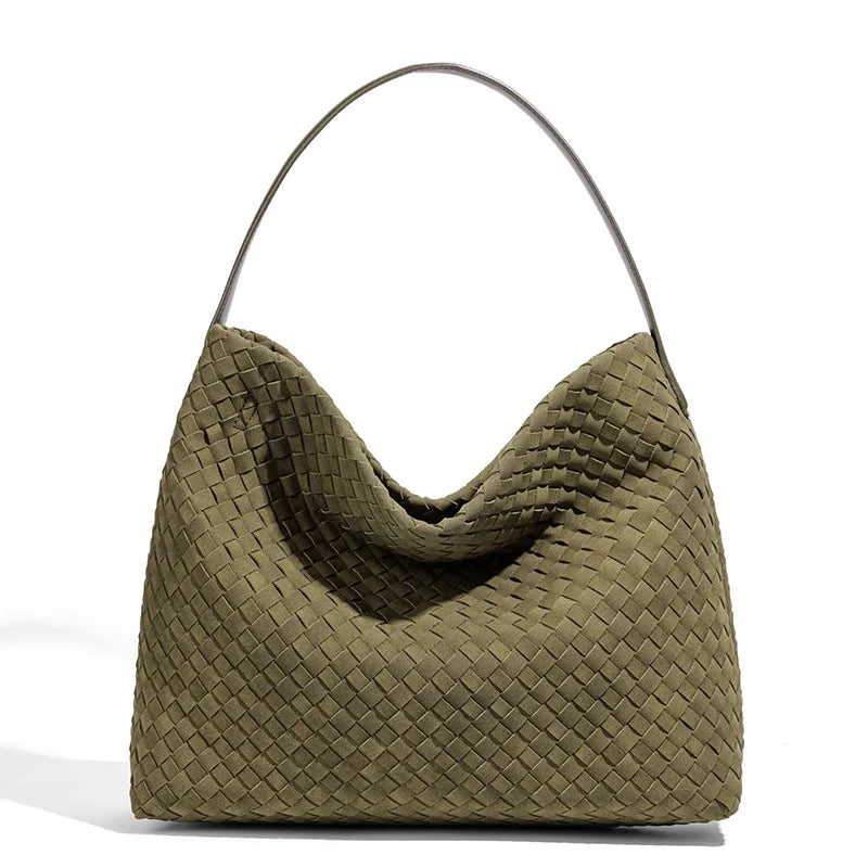 Green woven handbag on a white background