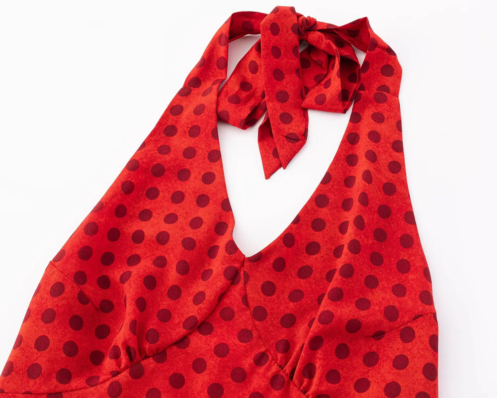 Close-up of red polka dot halter neck dress neckline