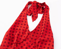 Close-up of red polka dot halter neck dress neckline