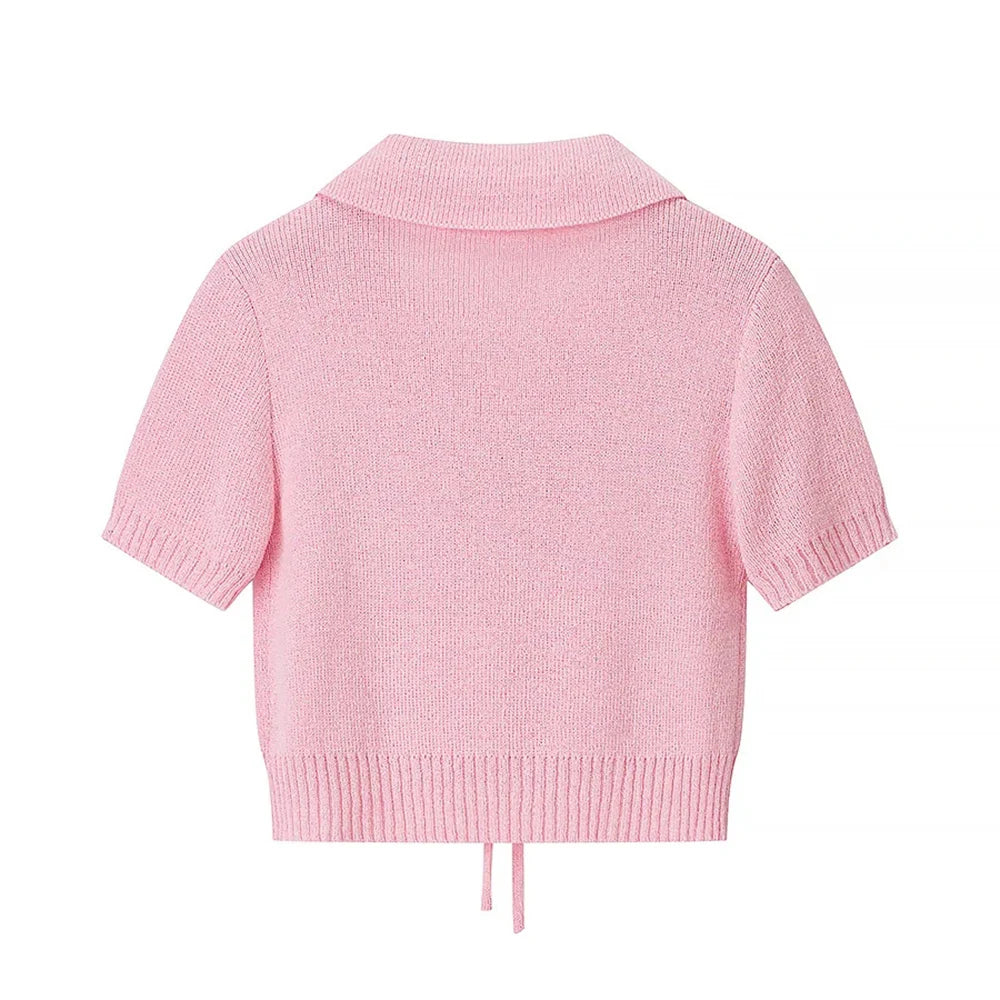 Pink knitted cardigan on a white background