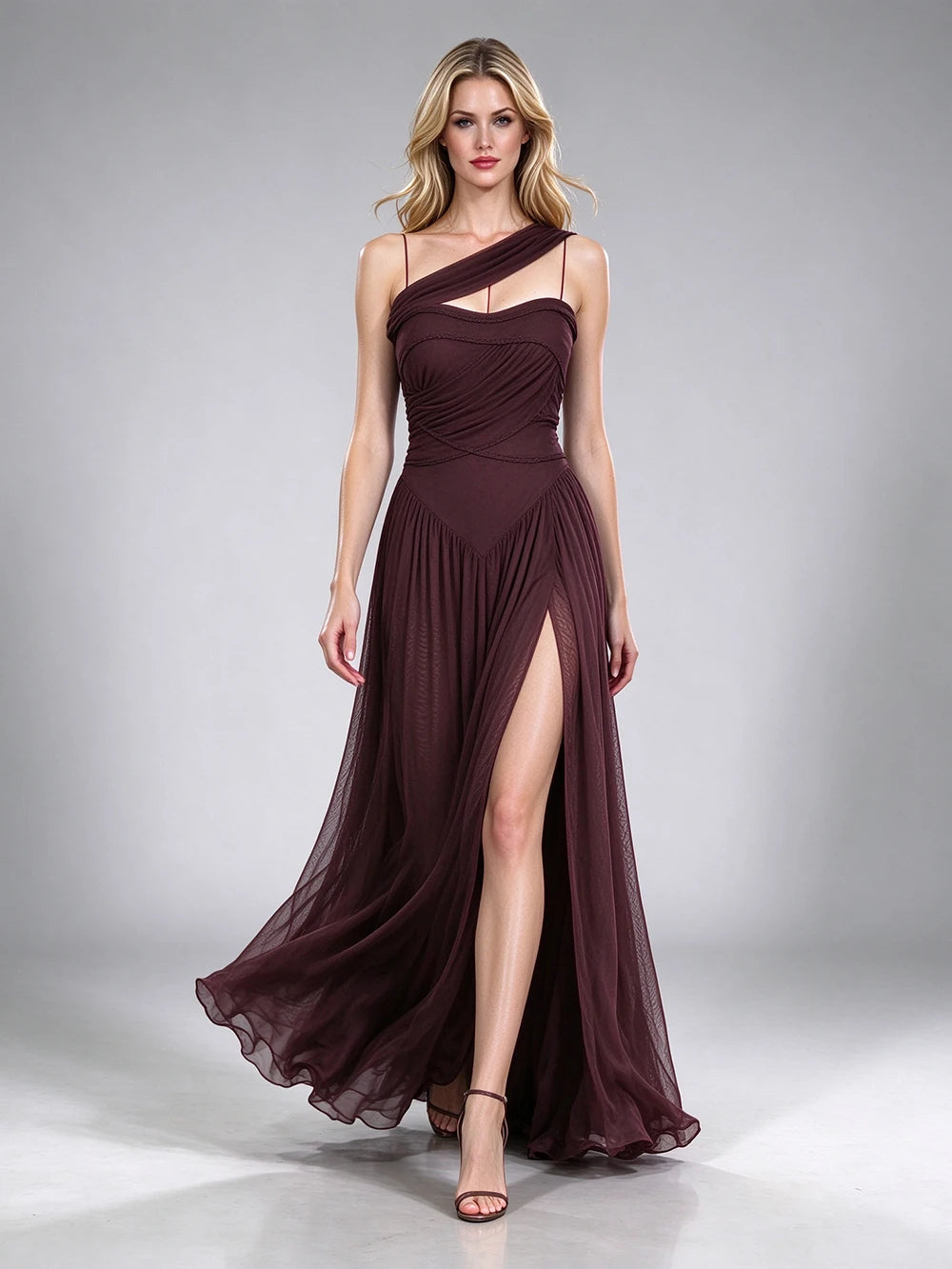 Brown one-shoulder draped formal gown with a high leg slit.