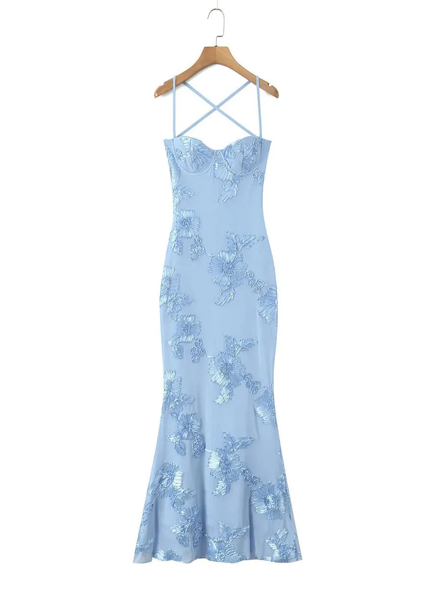 Light blue evening gown with floral lace details on a hanger against a white background