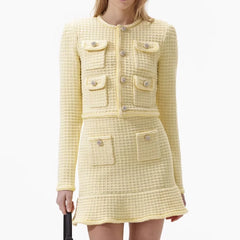 Yellow tweed dress with matching jacket on a white background