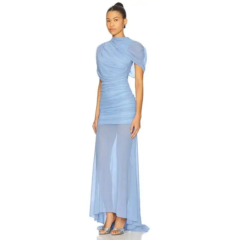 Woman wearing a light blue evening gown on a white background
