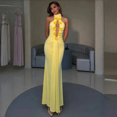 Woman wearing a yellow halter neck floral gown